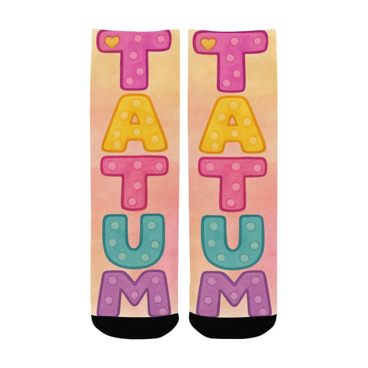 Colorful kids socks with the name Tatum in large pastel watercolor letters, inspired by the children’s book My Mommy Lives in Heaven.