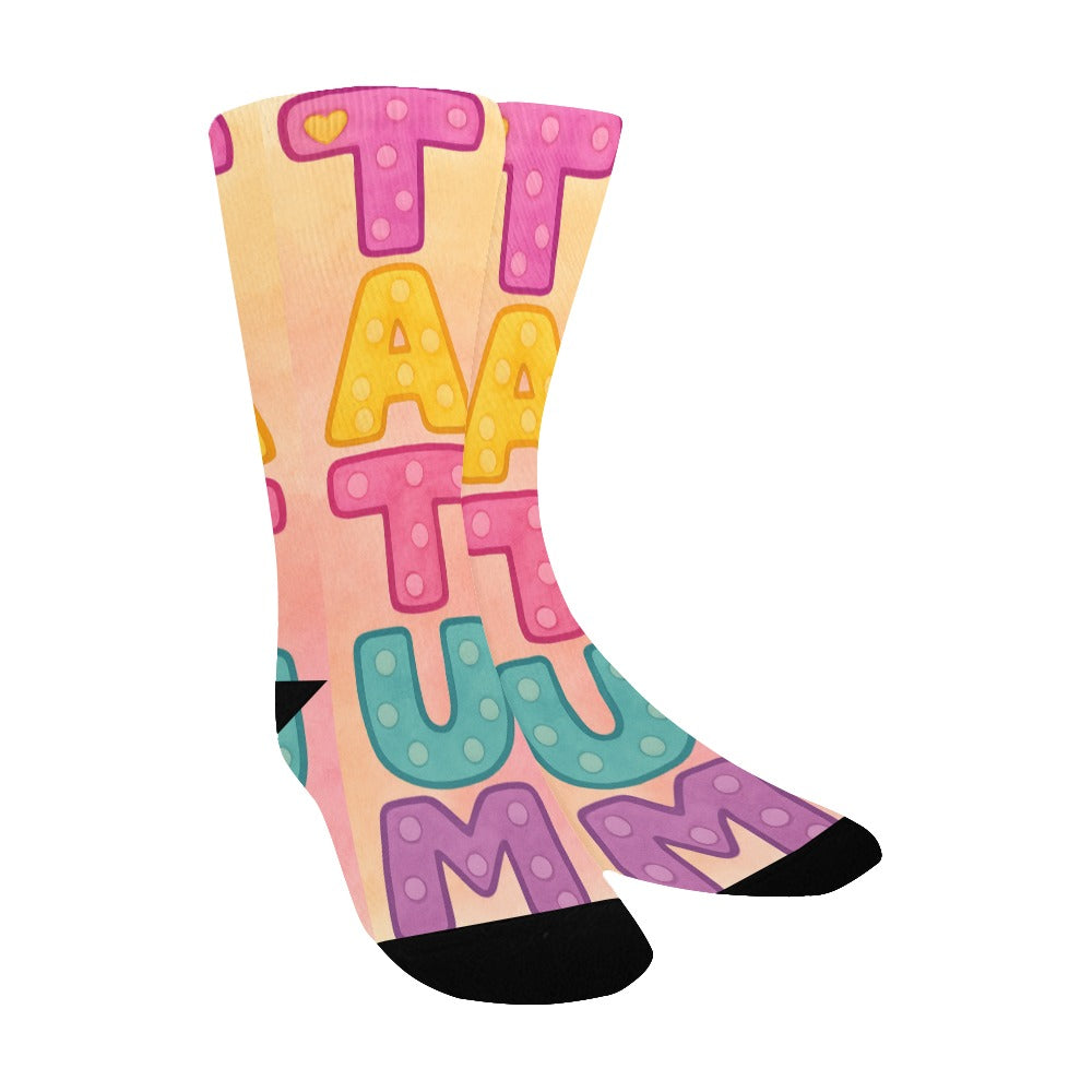 Colorful kids socks with the name Tatum in large pastel watercolor letters, inspired by the children’s book My Mommy Lives in Heaven.