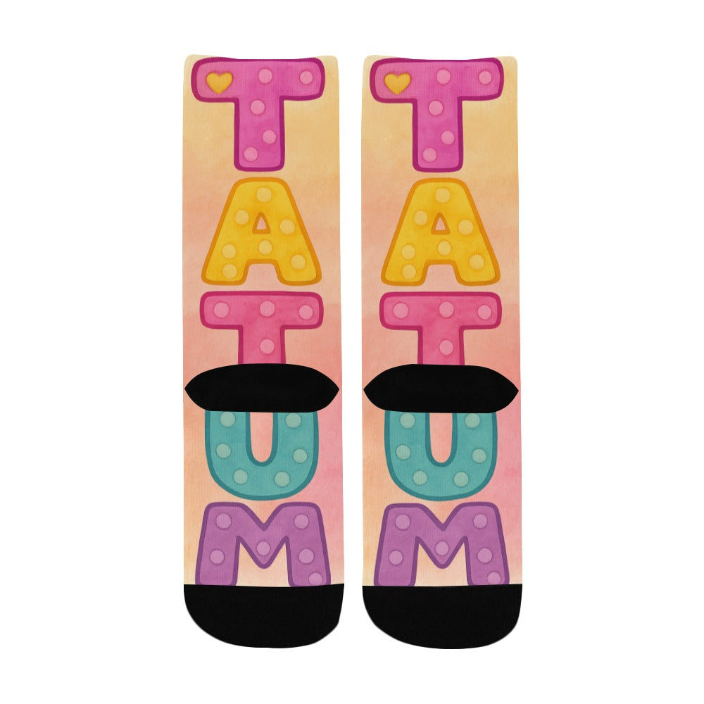 Colorful kids socks with the name Tatum in large pastel watercolor letters, inspired by the children’s book My Mommy Lives in Heaven.