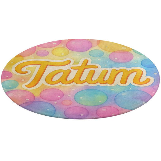 Round coral fleece rug with pastel bubble background and personalized child’s name in playful script, inspired by Tatum’s Love Bundle.