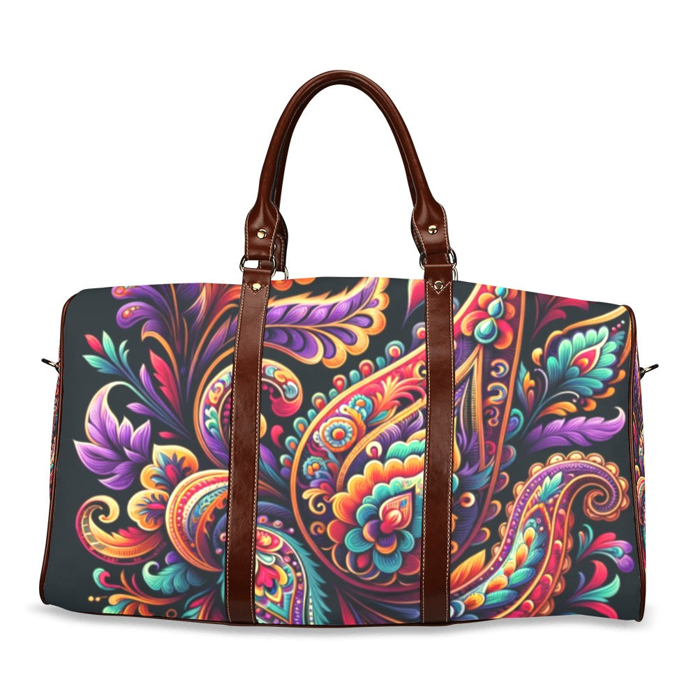 Vivid Luxe Paisley Duffel Bag with a bold colorful paisley print, waterproof fabric, and brown leather straps for stylish travel.